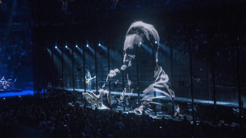 a photograph of a stage with a digital screen in front of it
