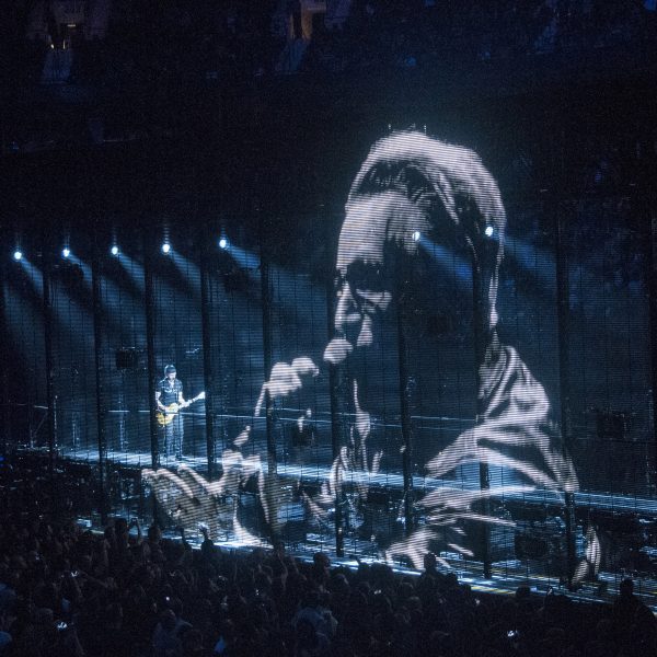 a photograph of a stage with a digital screen in front of it