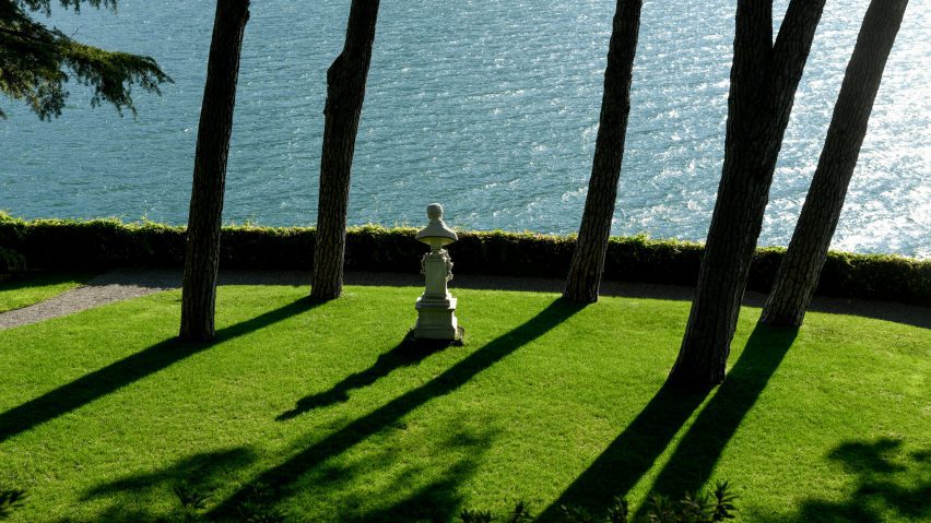 Photo of bust on grass in front of the sea