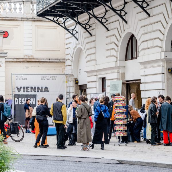 Photo of people stood outside building in Vienna