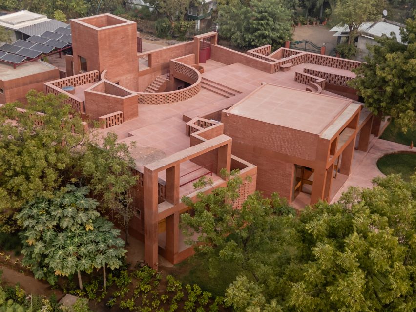 Overview of Indian vill with terracotta-coloured facade
