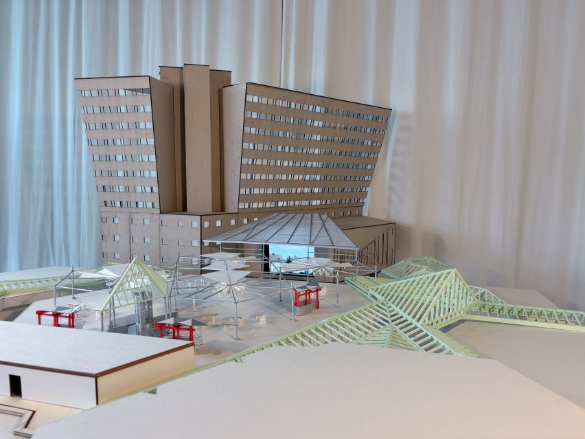 a photograph of an architectural model in tones of beige and white