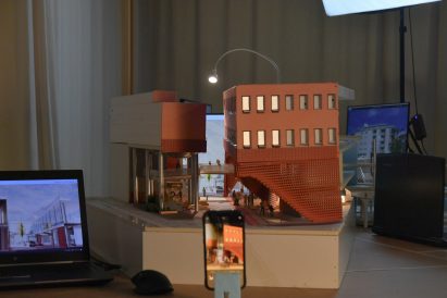 a photograph of an architectural model in tones of brown and beige