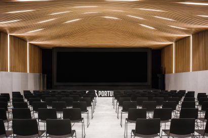 Timber-lined auditorium by OODA