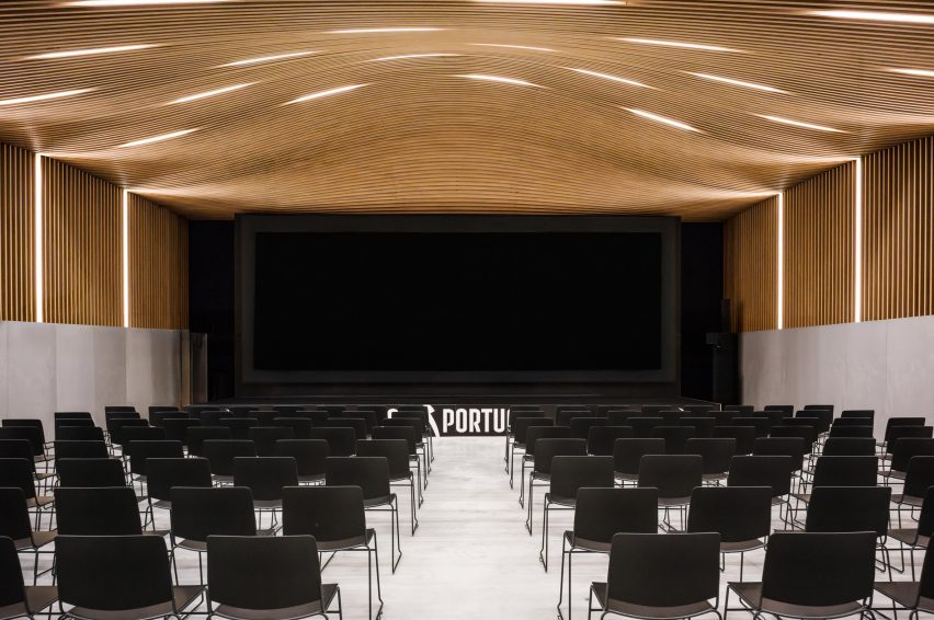 Timber-lined auditorium by OODA