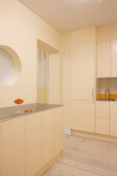 Yellow kitchen with wooden floor