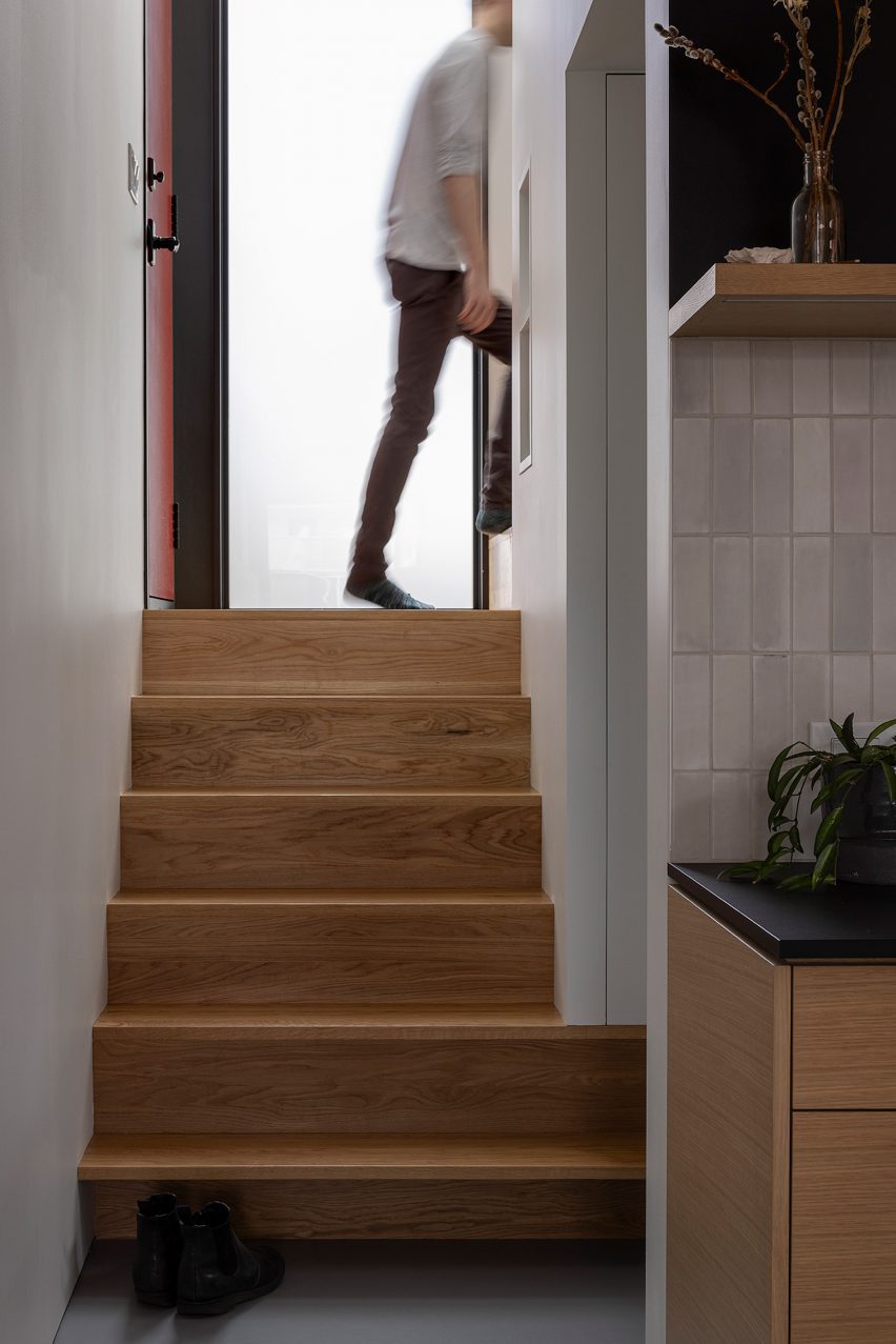 Person walking up wooden steps