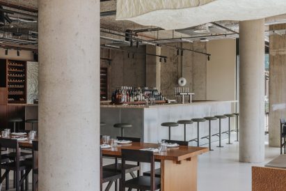 Metal-clad bar of Canal restaurant interior in London by A-nrd
