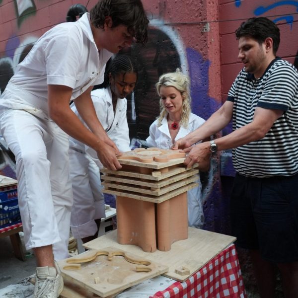 people pouring concrete into a frame