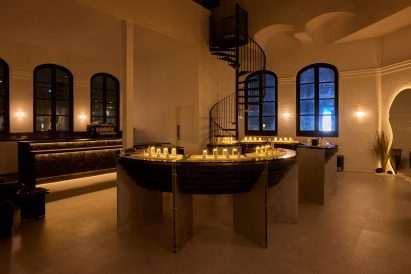 Softly lit fragrance boutique interior at night
