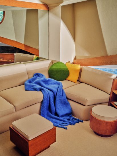 Bright throw and cushions on a beige sofa