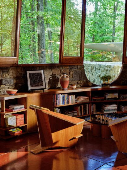 Sitting area in the Toyhill House with large windows and views of the woodland