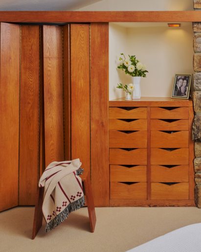 Built-in oak closet in a bedroom