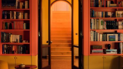 Colourful library in German home