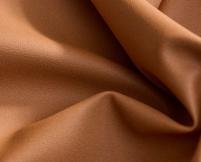 Photo of Hyphyn performance vinyl in a tan brown colour, crumpled to show pliability