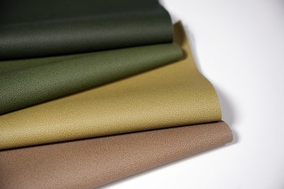 Photo of Hyphyn vinyl in four shades: a dark green, a mid green, a light khaki green and a taupe
