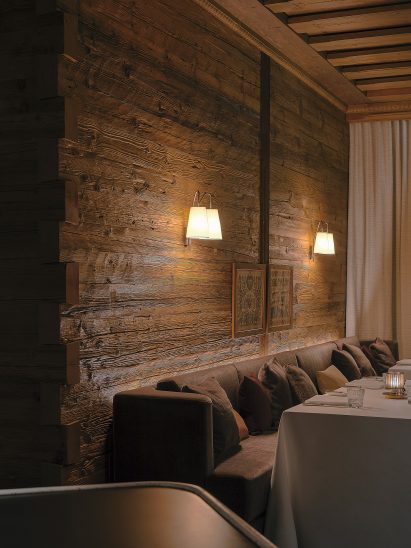 Wood clad walls and banquette sofa