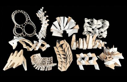 A photograph of multiple cardboard models in abstract shapes
