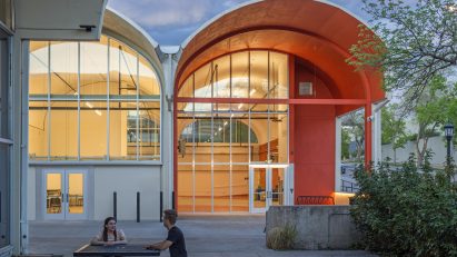 Vaulted arts hub with orange