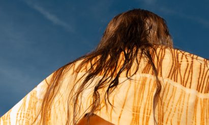 a photograph of a person wearing a yellow garment
