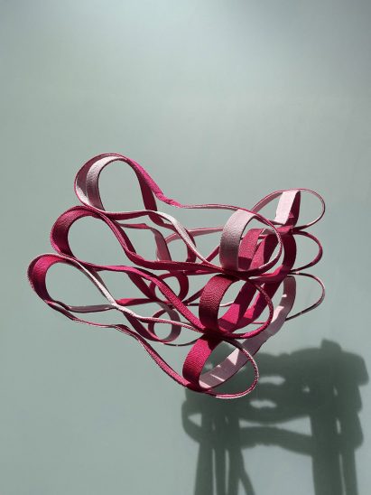 a photograph of a pink abstract structure
