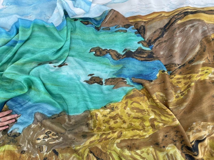 a photograph of a sheet of fabric in tones of brown, blue and turquoise