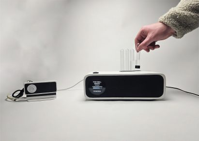 a photograph of a person's hand interacting with a device