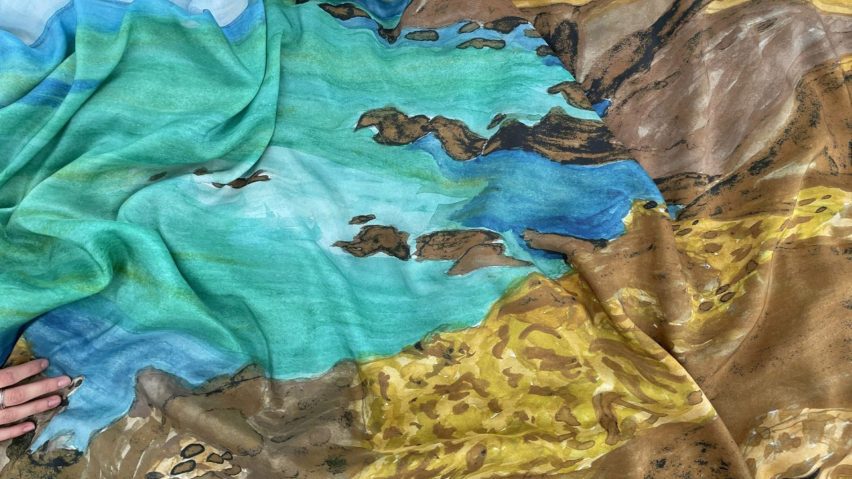 a photograph of a piece of fabric in tones of turquoise, brown and blue