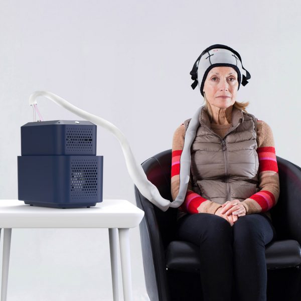 a photograph of a person using a chemotherapy relief device