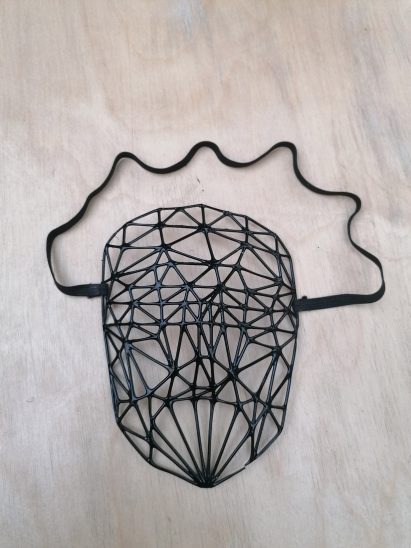 a photograph of a mask design in tones of black
