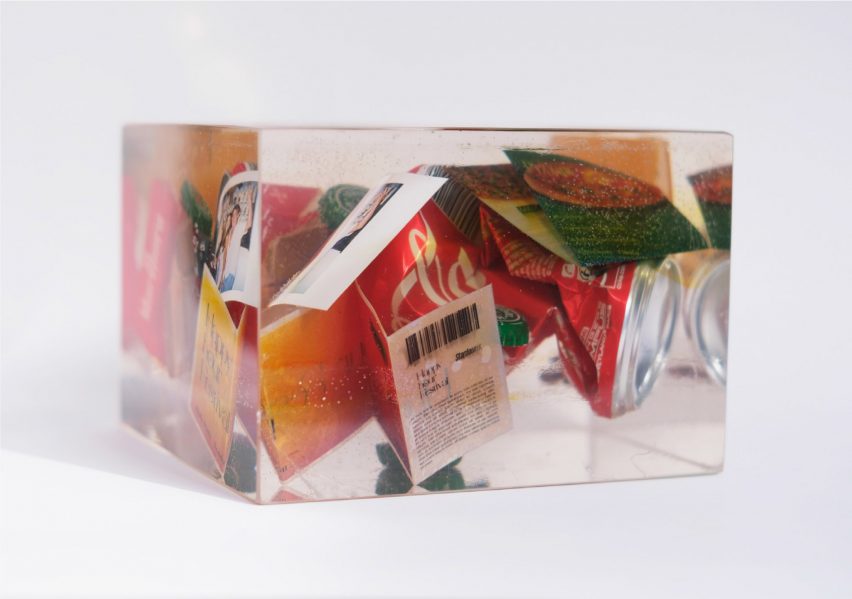 a photograph of objects within a clear resin cube