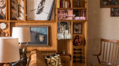 Display of objects and artworks on wall, sofa and furniture