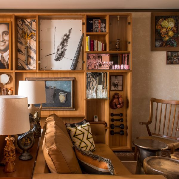 Display of objects and artworks on wall, sofa and furniture