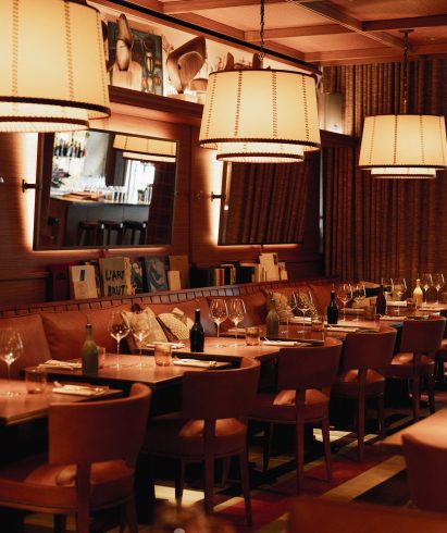 Low-lit restaurant space with double-shaded lamps