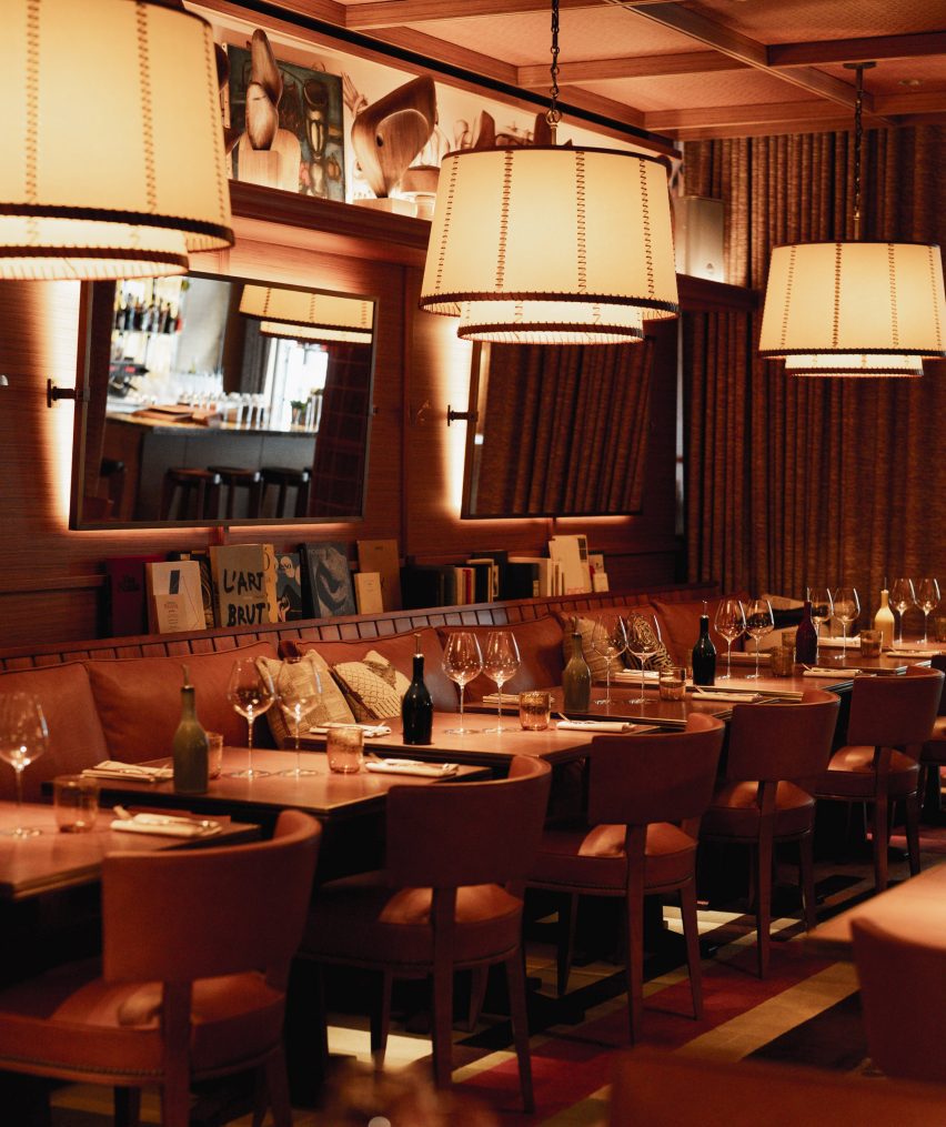 Low-lit restaurant space with double-shaded lamps