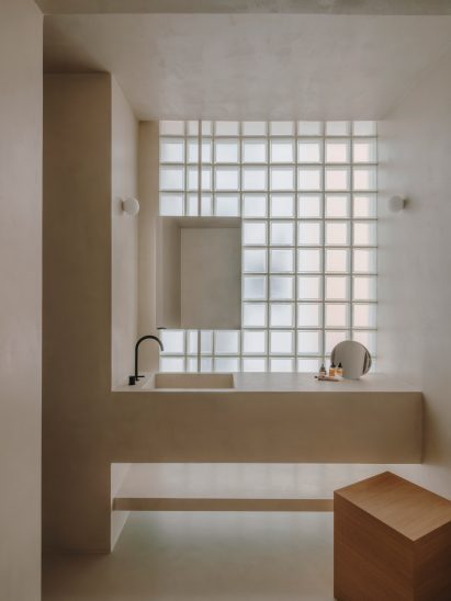 Bathroom with glass block walls by Isern Serra