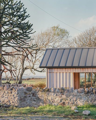 Larch-clad extension to a home in Wales