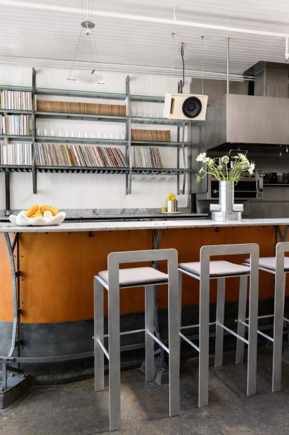 Marble bar counter with plywood front and new metal stools