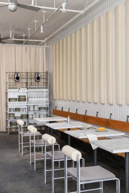 Acoustic panels mounted above a plywood bench