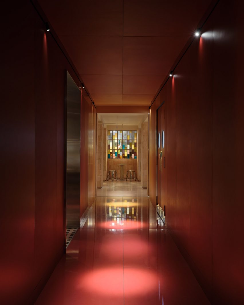 Corridor lined with red panels