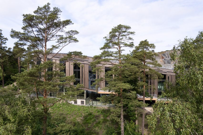 Timber building in front of quarry