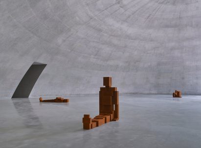 Cast-iron sculpture within concrete gallery by Tadao Ando and Antony Gormley