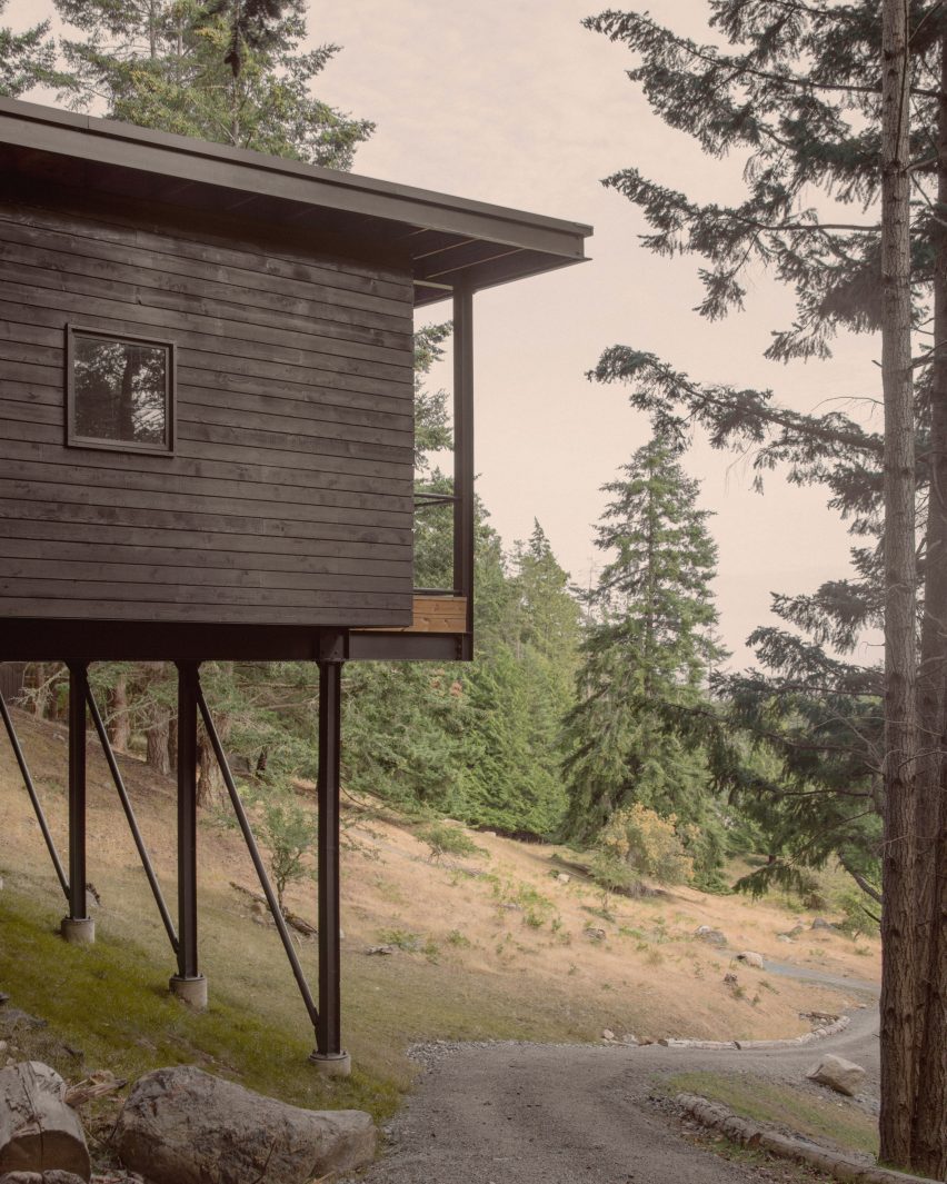 Black cabin on supports