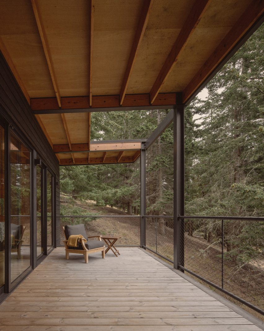 Black cabin with porch