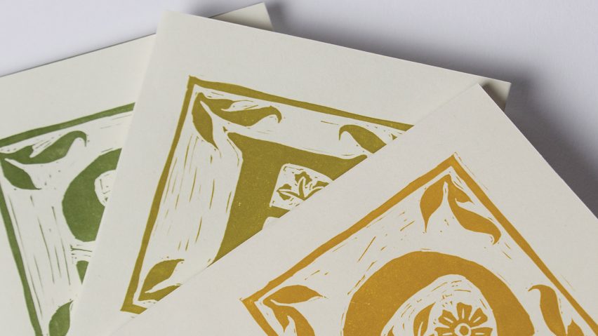 a photograph of three books in tones of white, yellow and green