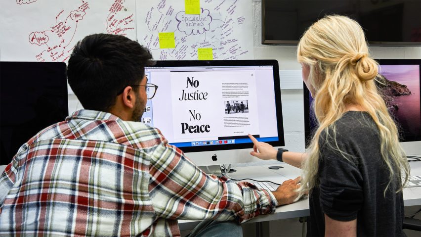 a photograph of two students using a computer
