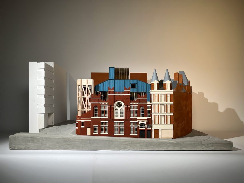 a photograph of an architectural model in tones of brown and blue