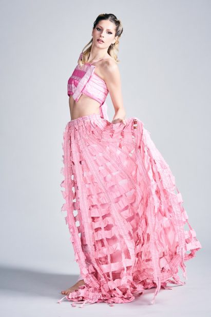 a photograph of a person wearing pink garments