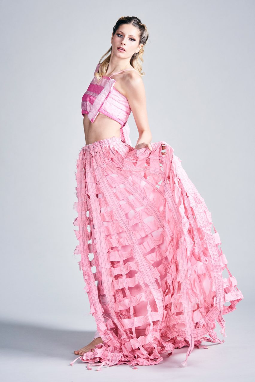 a photograph of a person wearing pink garments