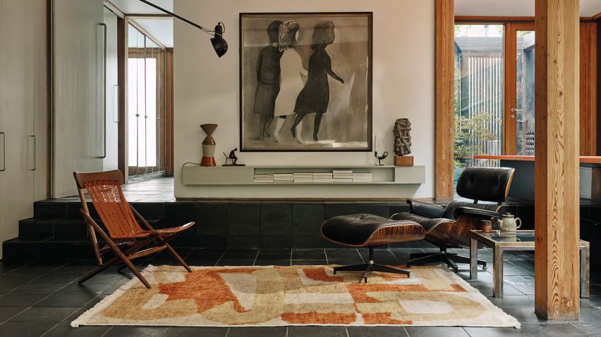 Photo of living room with leather chairs on a Christopher Farr rug